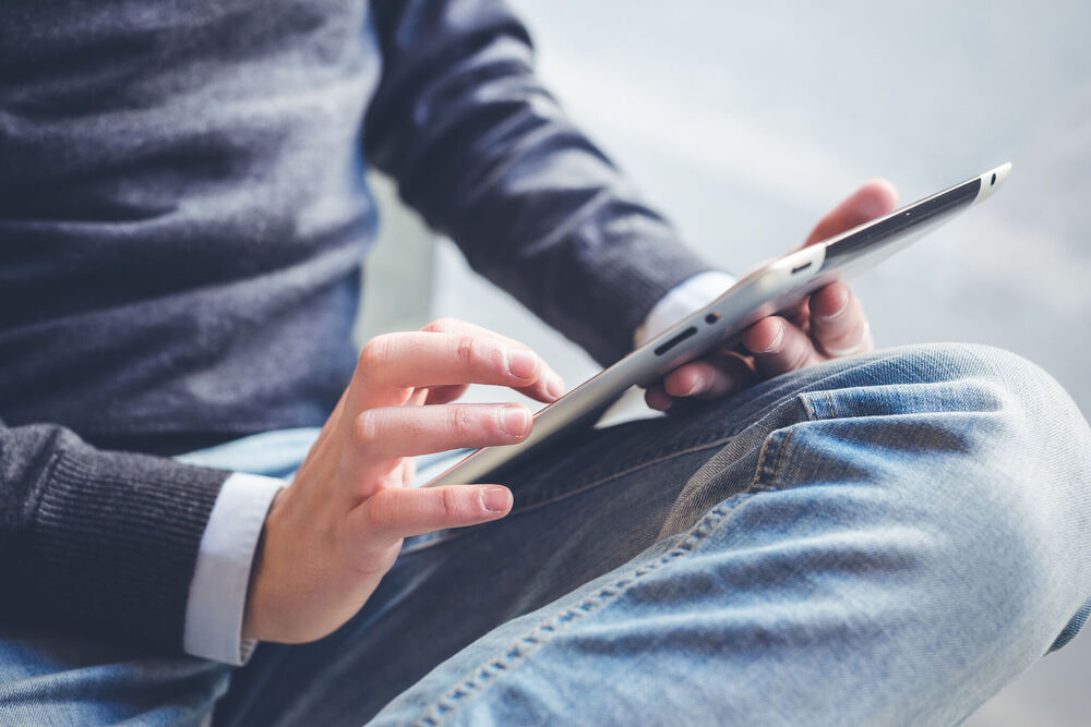 Man looking at tablet