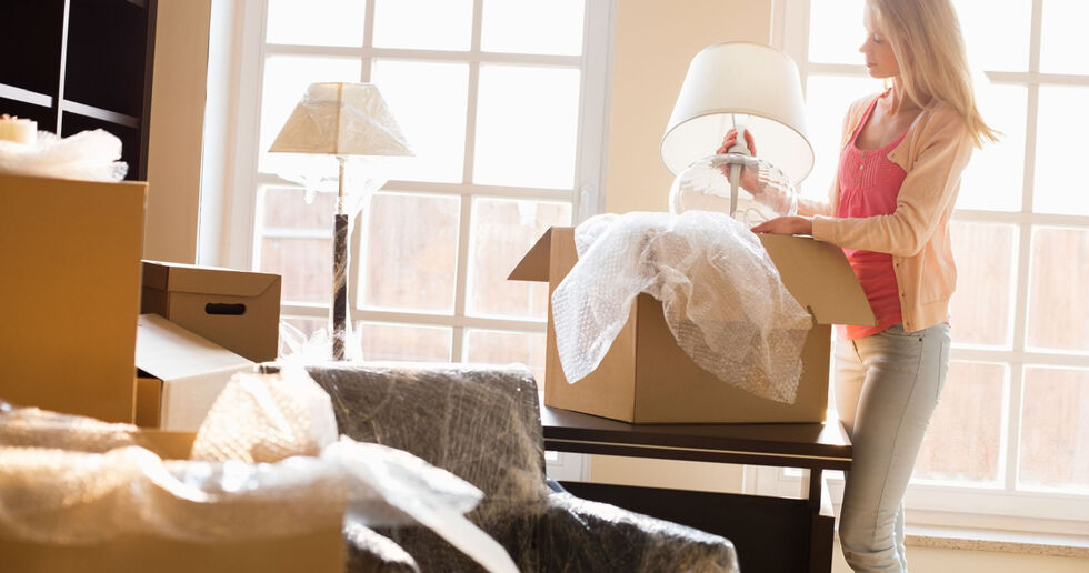 A person unpacking boxes