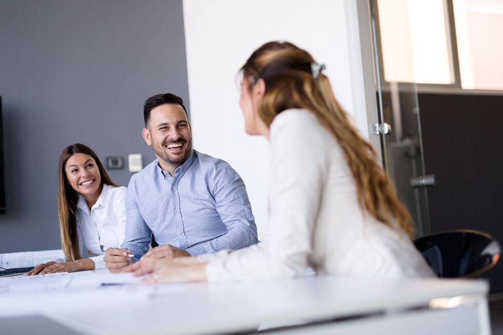 Happy team members at work