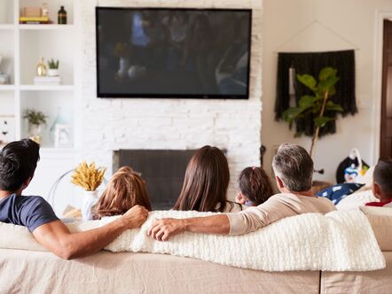 Family watching a TV