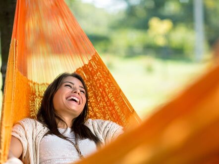 Happy lady in a hammock