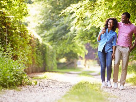 Couple walking down a pretty lane